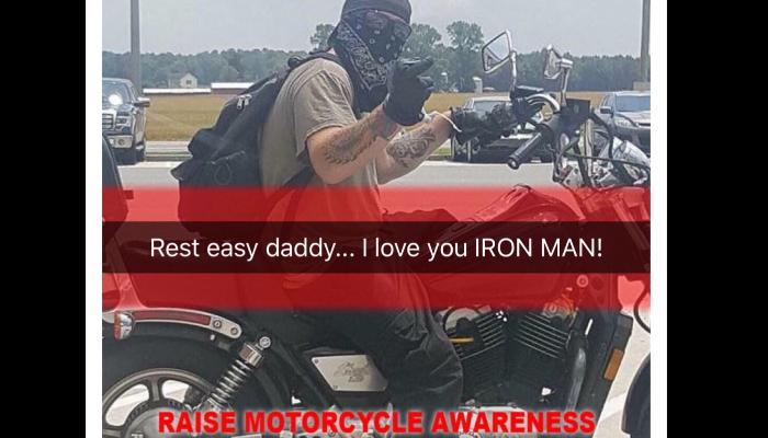 A motorcyclist on a red bike with text: "Rest easy daddy... I love you IRON MAN!" and "RAISE MOTORCYCLE AWARENESS"