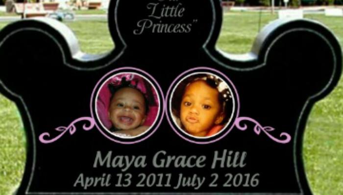Crown-shaped black headstone reading "Our Little Princess Maya Grace Hill" with photos of a young girl.