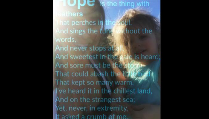 Woman holding a young girl in sunlight with Emily Dickinson's poem "Hope is the thing with feathers" overlaid.