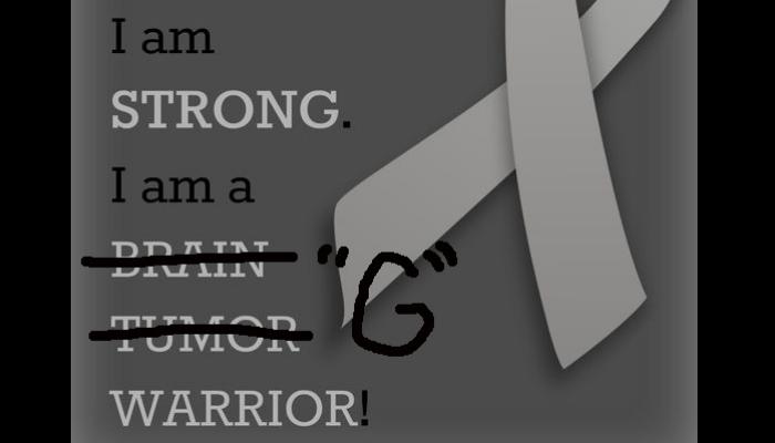 Gray ribbon with text 'I am STRONG. I am a BRAIN TUMOR WARRIOR!' where 'BRAIN TUMOR' is crossed out and replaced by 'G'.