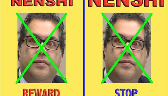 Yellow posters with "NENSHI" and a crossed-out man with glowing red eyes, labeled "REWARD" and "STOP".