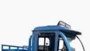 A small blue utility truck with an enclosed cab and rear cargo bed against a white background.