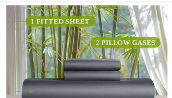 Folded dark gray sheet set displaying 1 fitted sheet and 2 pillowcases in front of a window with bamboo trees.