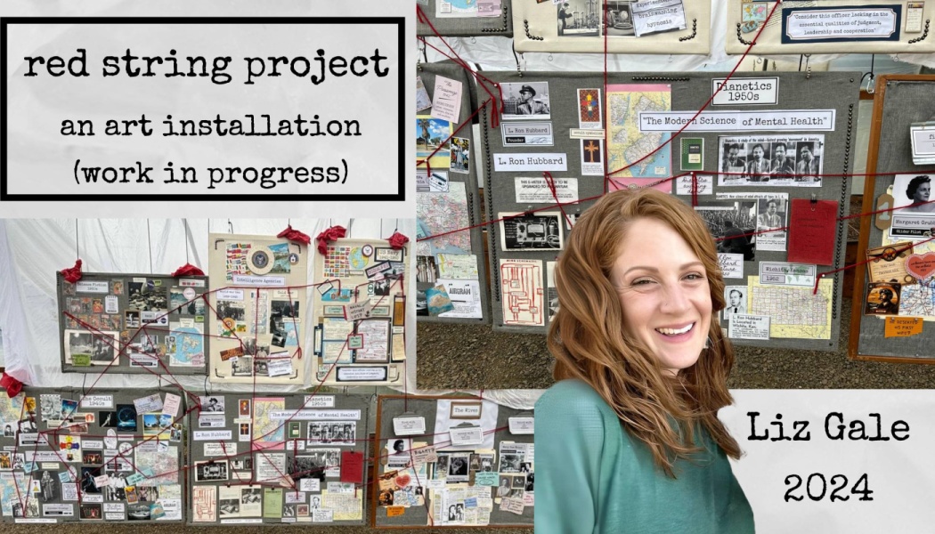 Liz Gale smiling in front of display boards connected by red string for the Red String Project art installation.