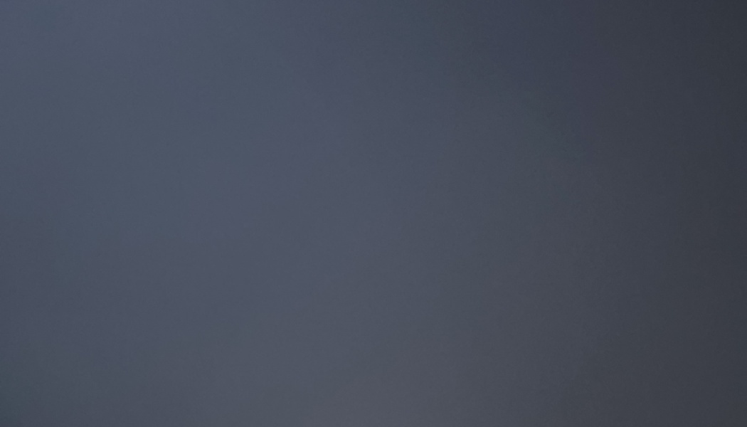 Solid dark blue-gray surface with a smooth, uniform texture.