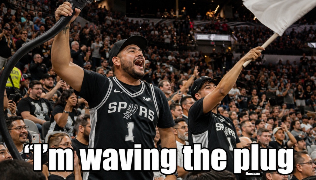 A cheering San Antonio Spurs fan holds a large plug while another waves a white flag in a packed arena.