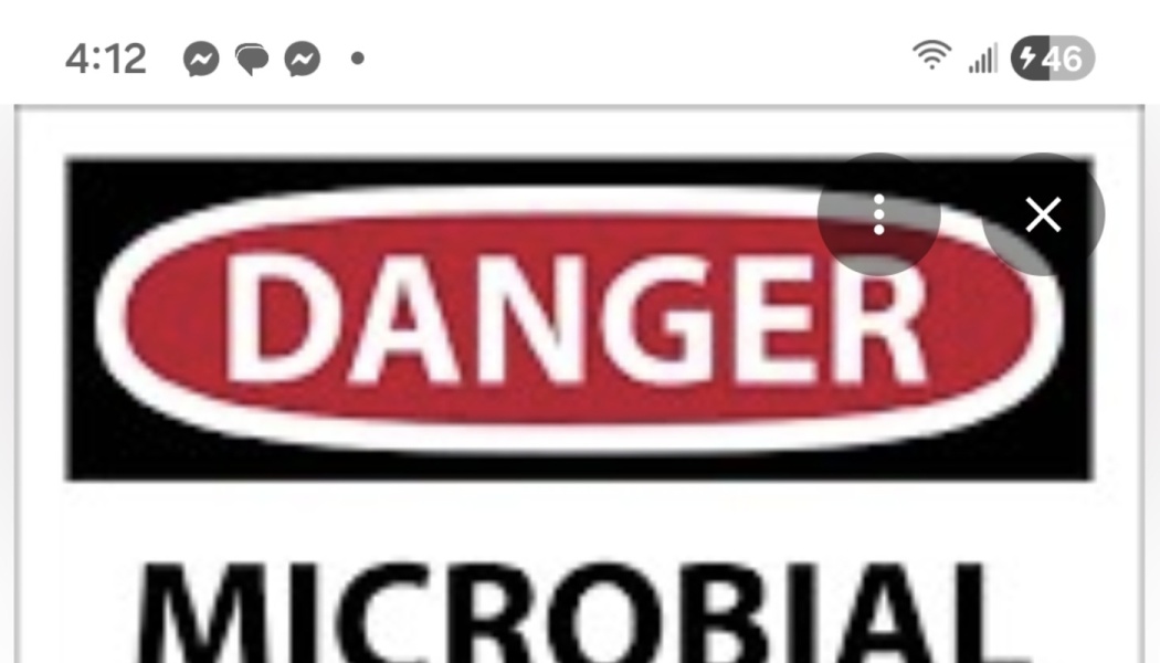 Danger sign with a red oval reading "DANGER" above the word "MICROBIAL".