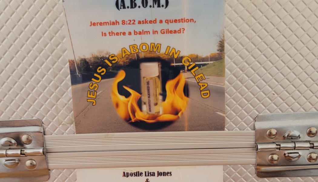 Religious sticker on a metal case reading "Jesus is A BOM in Gilead" with a flaming oil vial.