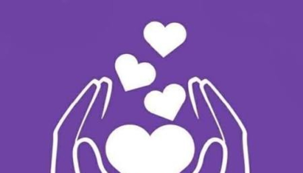 White icon of two hands cradling a heart with smaller floating hearts on a purple background.