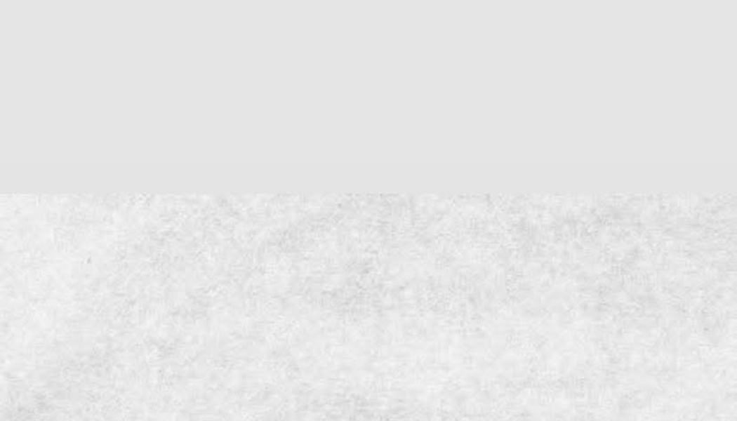 Horizontal split background with a smooth light gray top half and a textured light gray paper bottom half.