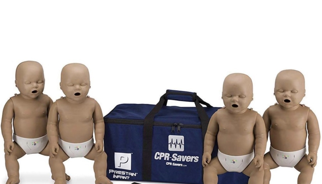 Four infant CPR training manikins arranged around a blue CPR-Savers carrying bag.