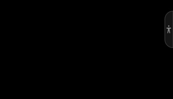 Black screen with a small grey accessibility widget icon on the right edge.