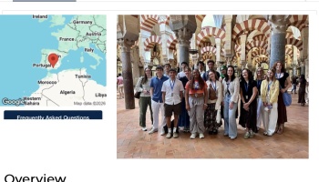 Map pin on Spain next to a group of students posing inside the Mosque-Cathedral of Córdoba.