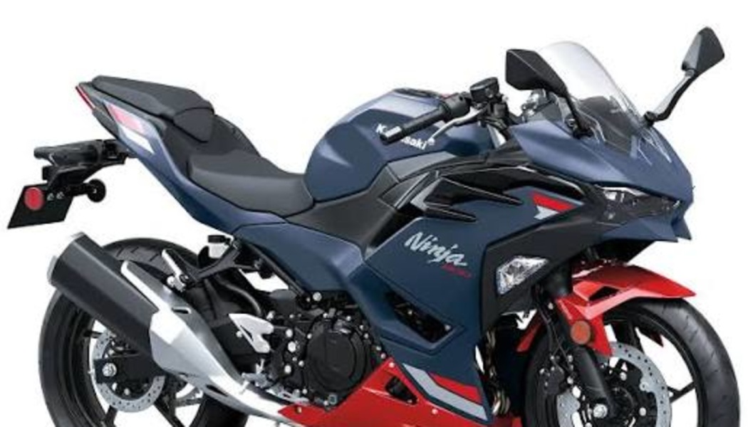 Sleek dark blue and red Kawasaki Ninja 400 sport motorcycle on a plain white background.
