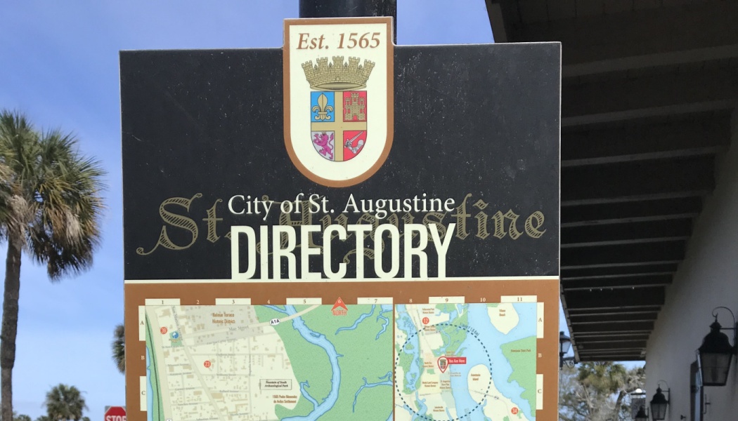 City of St. Augustine Directory sign featuring the city coat of arms and a street map below.