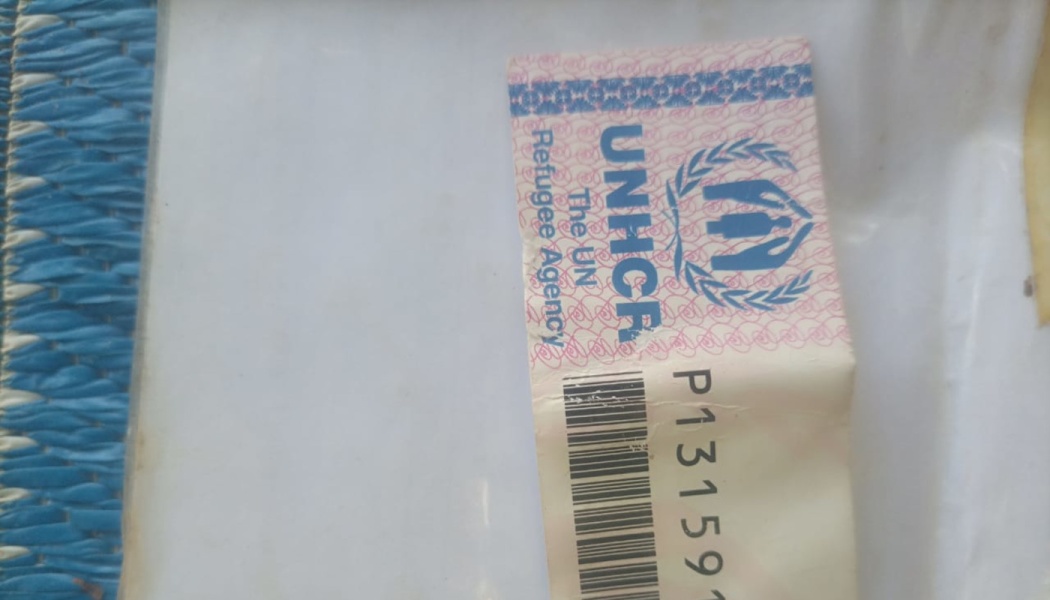 UNHCR document showing the UN Refugee Agency logo, a barcode, and an identification number.