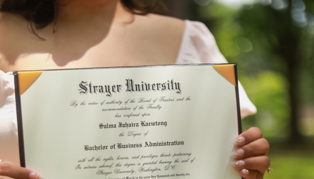 A graduate holding a Strayer University Bachelor of Business Administration diploma.