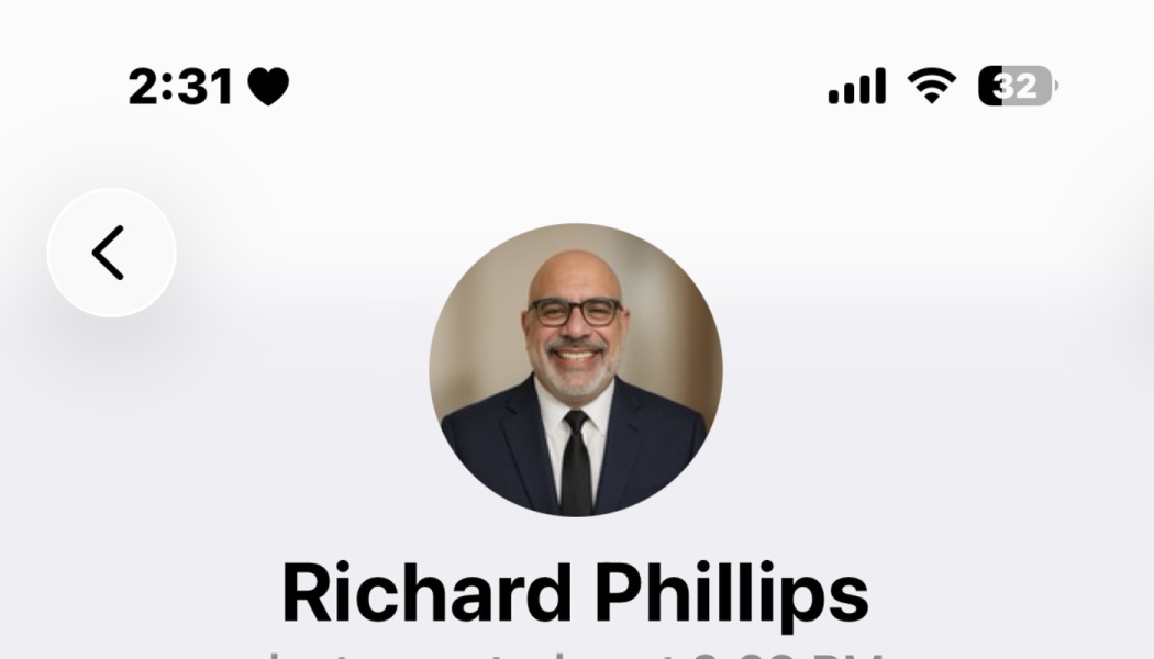 Profile view for Richard Phillips, featuring a circular headshot of a smiling man in a suit and glasses.