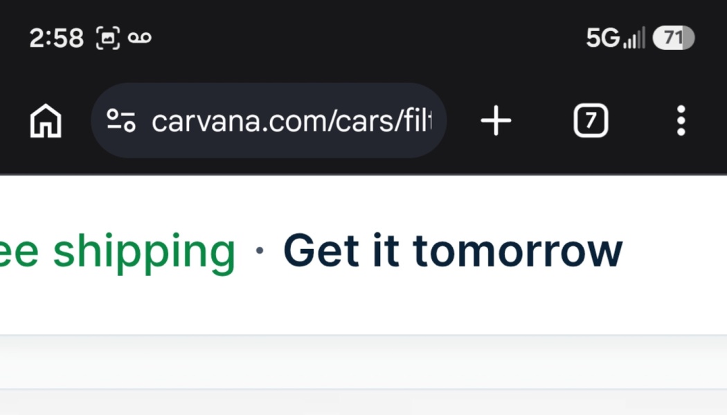 Smartphone screen displaying the Carvana URL bar above text reading "Free shipping · Get it tomorrow".