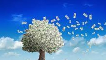 A money tree made of US dollar bills blowing away in the wind against a blue sky.