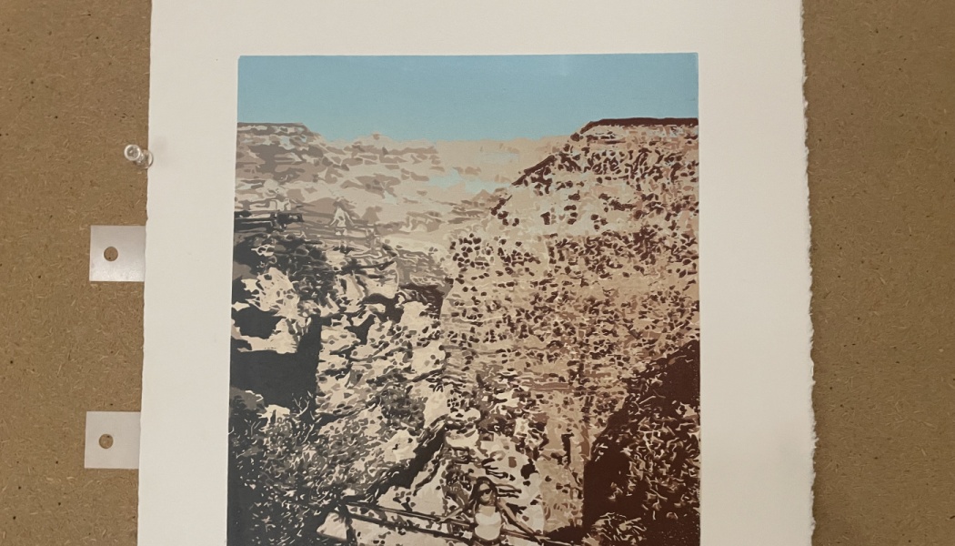 Art print depicting a person standing at a railing overlooking a vast, rocky canyon under a clear blue sky.