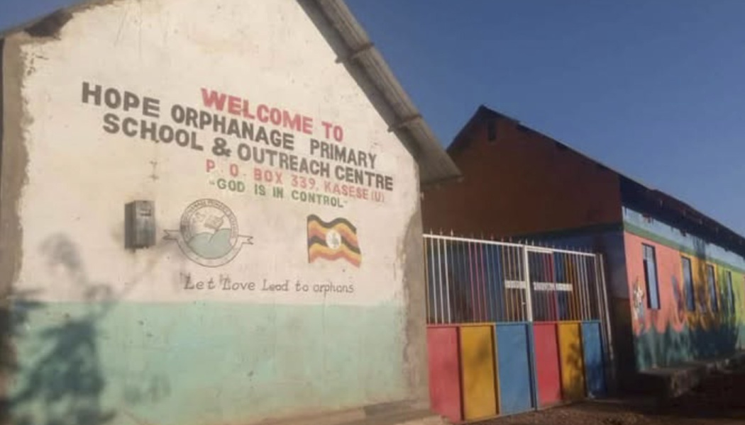 Hope Orphanage Primary School & Outreach Centre building and colorful gate in Kasese, Uganda.