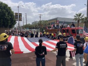 unfolding flag before march DTM rally LA
