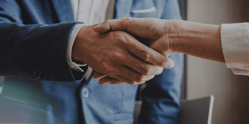 Two hands shaking like they're making a deal