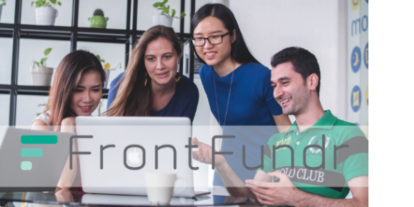 Team reviewing content on a  computer