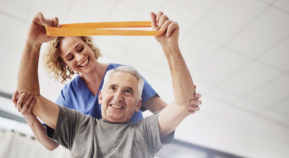Happy resident laughing with nurse at Comfort Residence