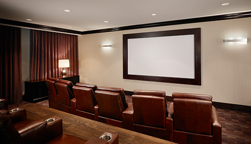 Host movie nights in a personal screening room at apartments in Atlanta, Georgia