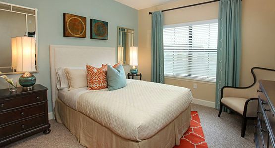 Bedroom in a senior apartment at our senior living facility in Wildwood, Florida