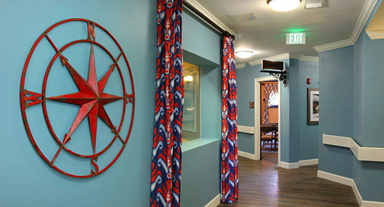 Well-decorated hallway in our senior living facility at American House Wildwood