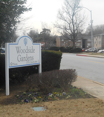 Our sign welcomes residents and guests at Woodside Gardens Apartments.