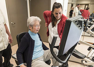 Residents enjoy working out at senior living in San Diego