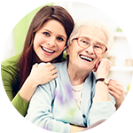 Caretaker having a conversation with a senior living resident at Storey Oaks of Tulsa