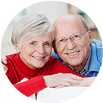 A resident and caregiver laugh together at Storey Oaks of Tulsa in Tulsa