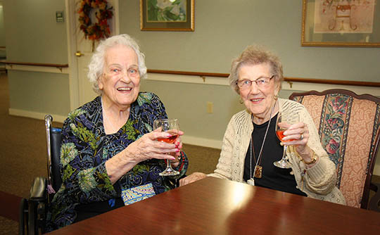 two women enjoying wine at Carriage Court of Hilliard in Hilliard