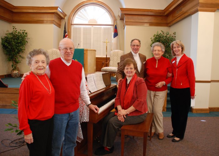 Posed at piano in activities building at The Clinton Presbyterian Community