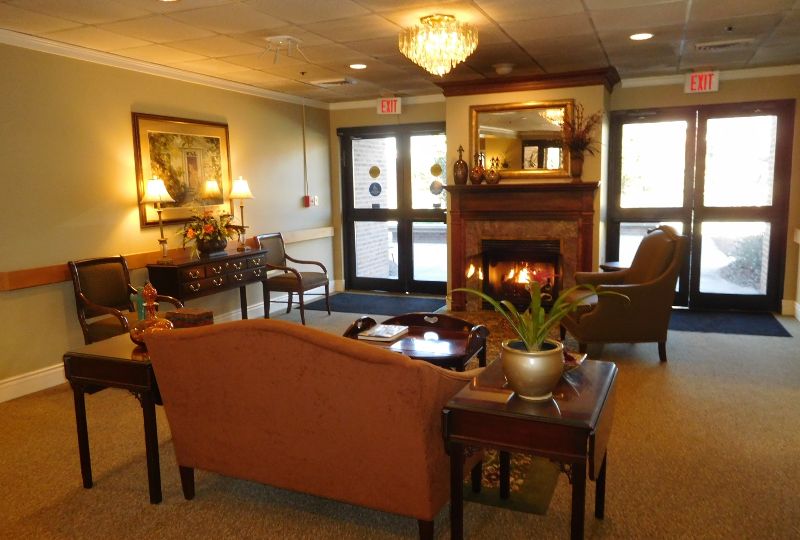 resident lounge with fireplace at The Columbia Presbyterian Community in Lexington, SC