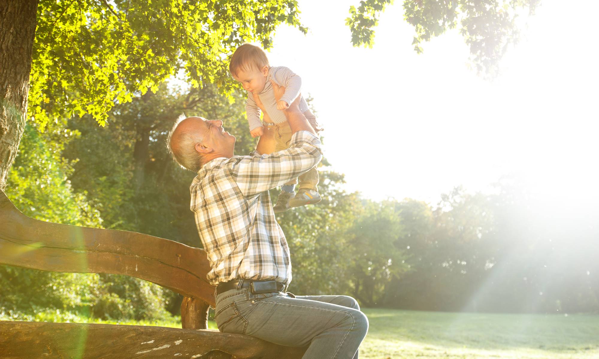 Man holding grandchild at St. Andrews Memory Care