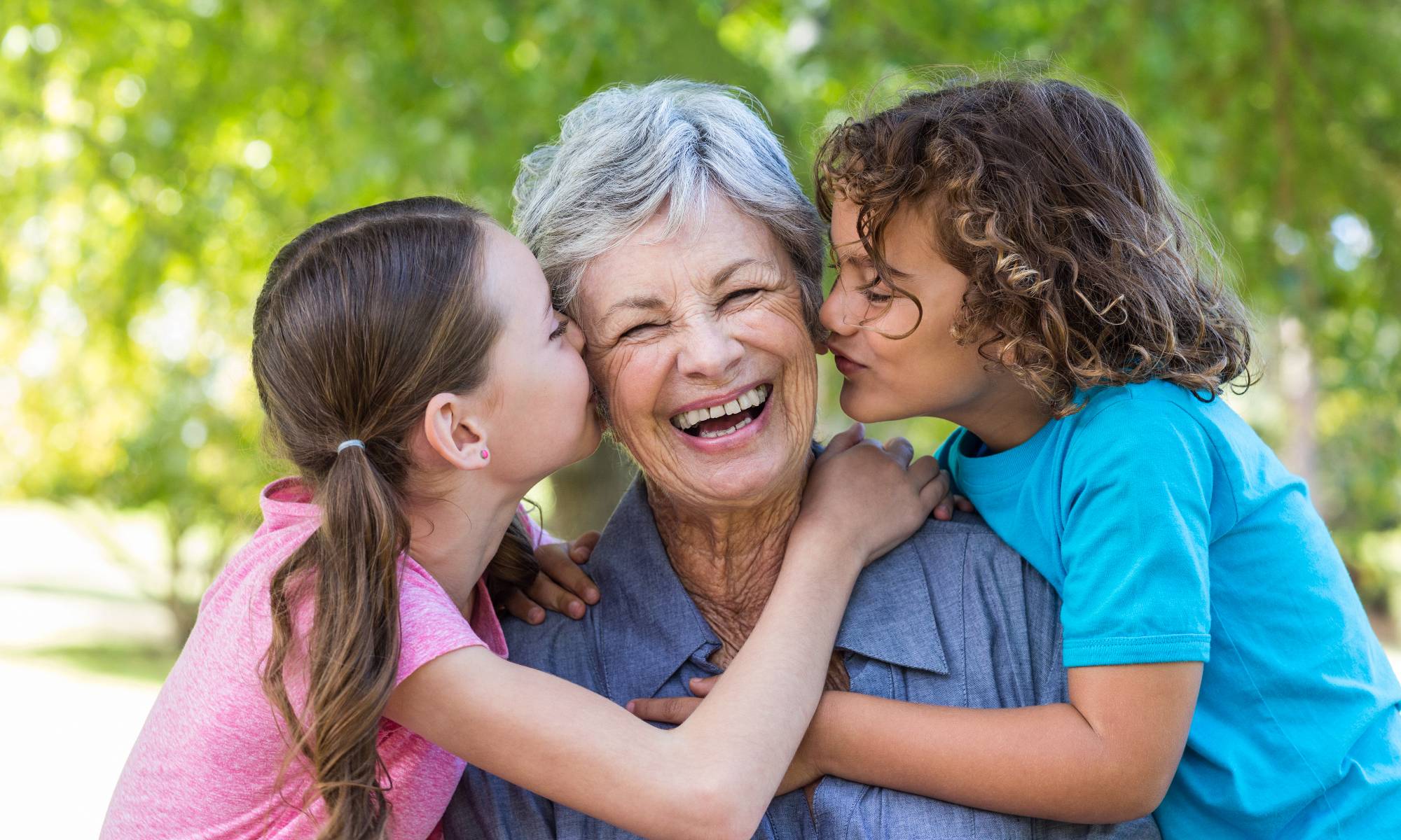 Happy grandmother with her granddaughters enjoying Pacifica Senior Living Victoria Court amenities