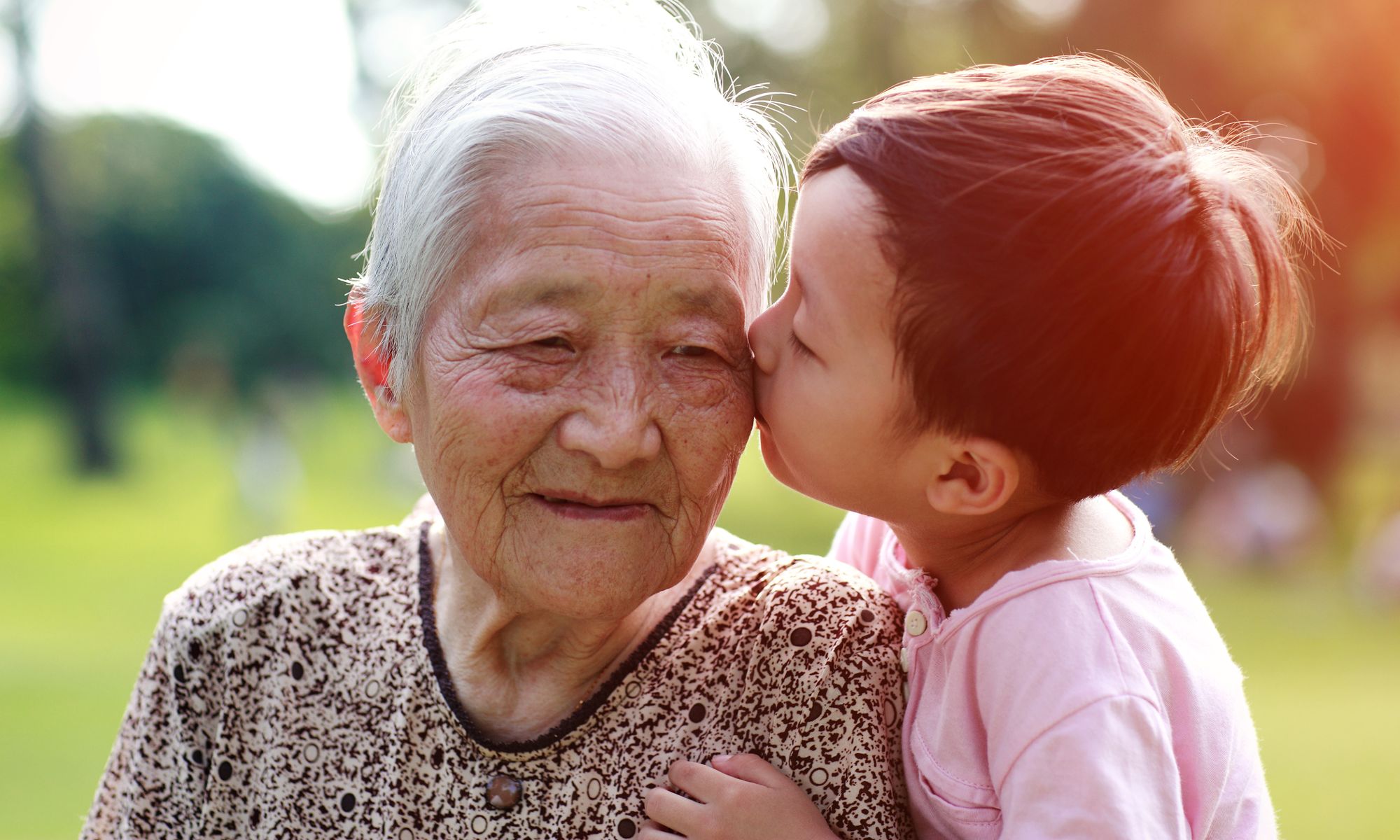 Little boy kissing his Grandma at Pacifica Senior Living Victoria Court