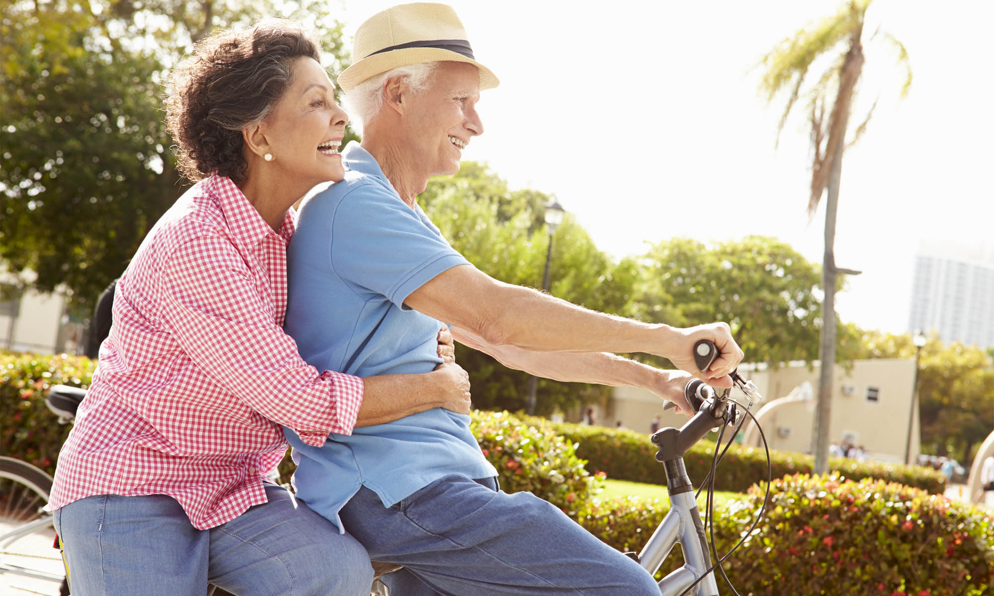 Couple riding bicycle at The Meridian at Westwood