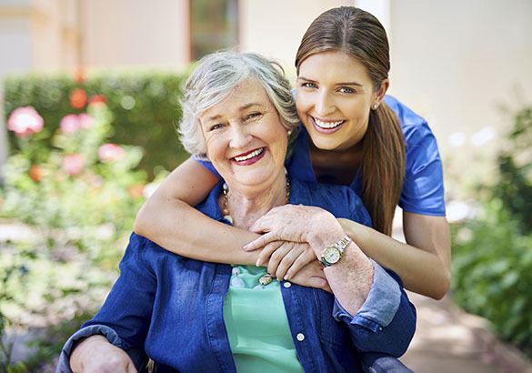 A senior resident at Pacifica Senior Living Pinehurst with her caretaker
