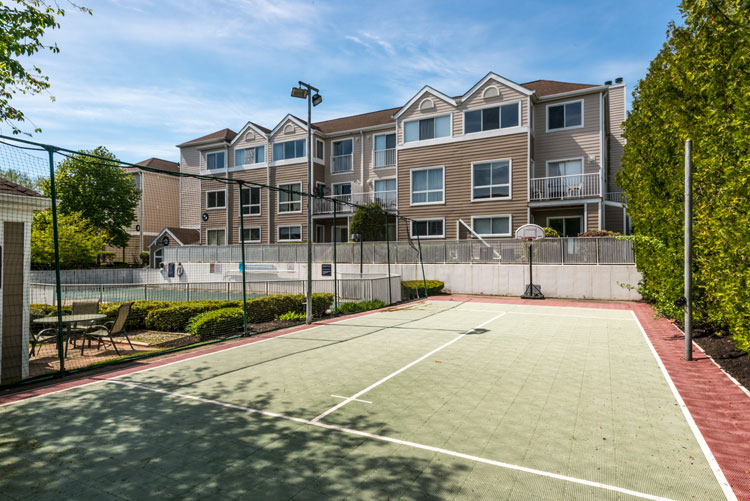 Residents enjoy the on-site gym & tennis at Flats at 390