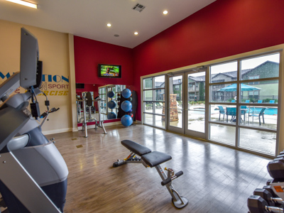 Fitness center at Springs at Fremaux Town Center Apartments in Slidell