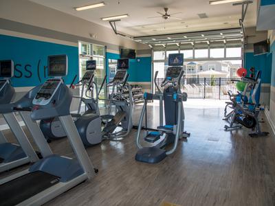 Fitness center at Springs at River Chase Apartments in Covington