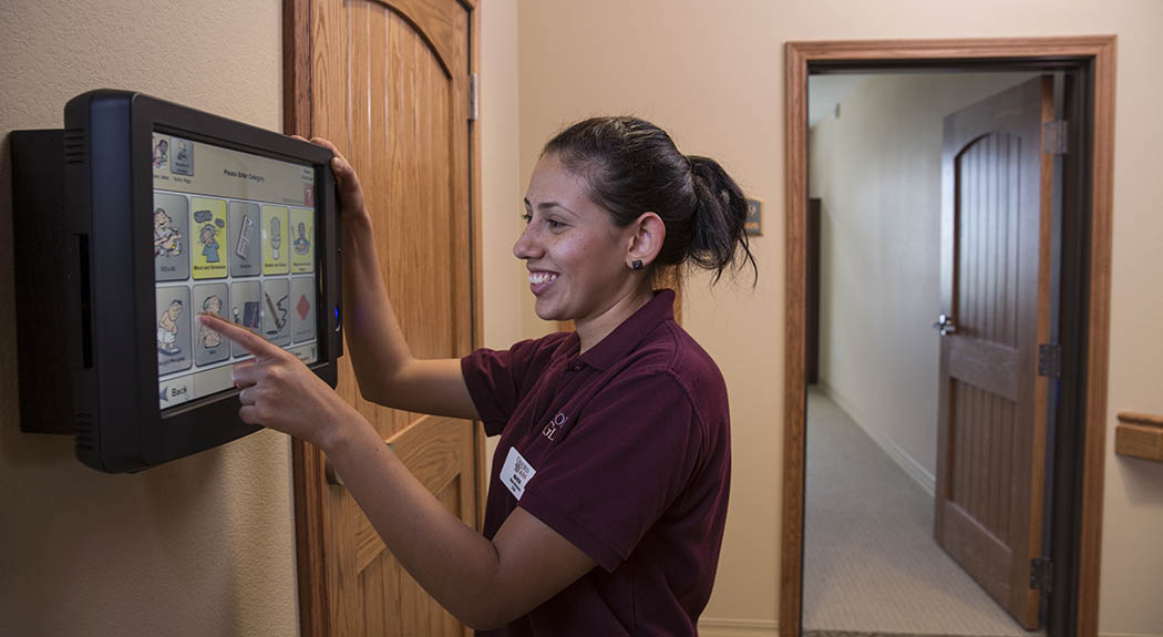Oxford Glen Memory Care at Grand Prairie team member utilizing CareTracker