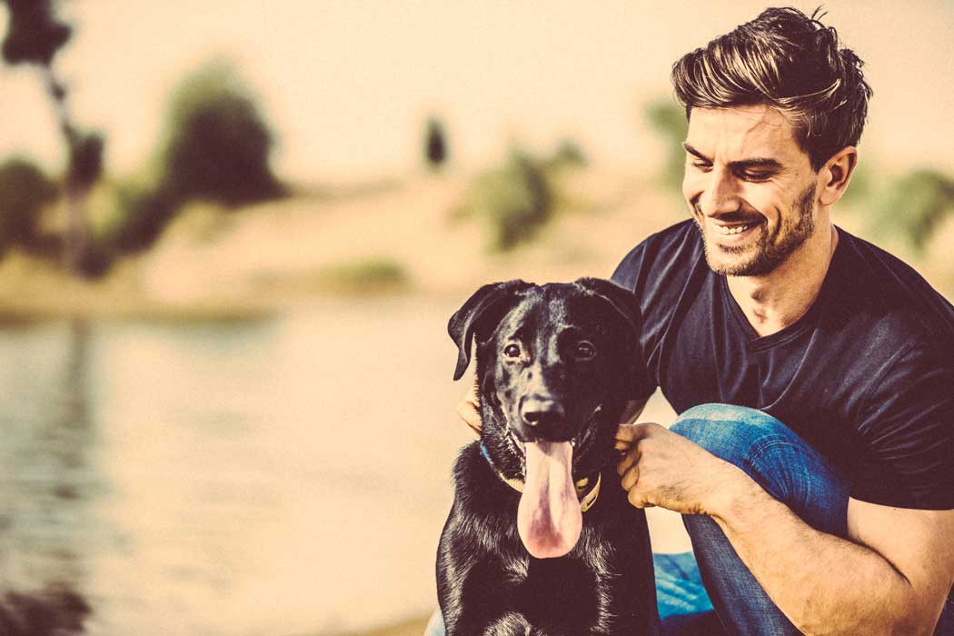 Resident and his dog at The Retreat Apartments in Phoenix